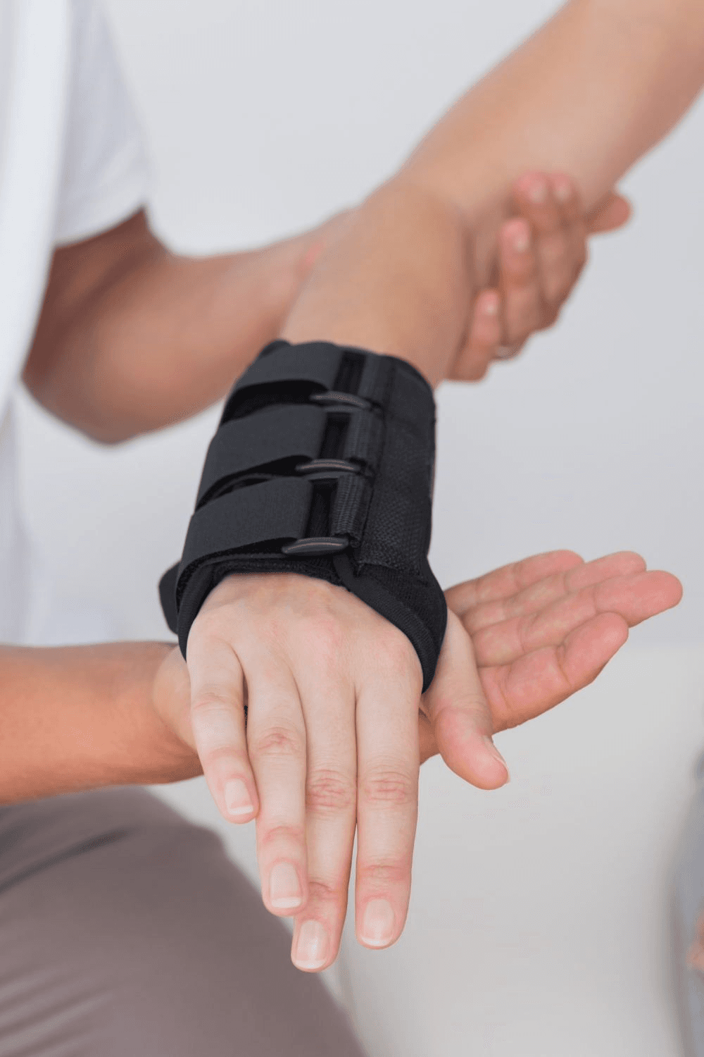 Cock-up wrist splint being fitted by a clinician